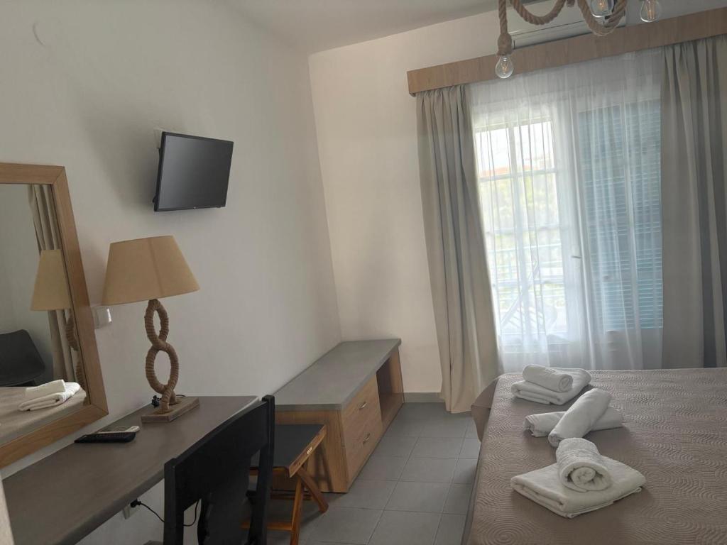 TV a/nebo společenská místnost v ubytování Astri Hotel