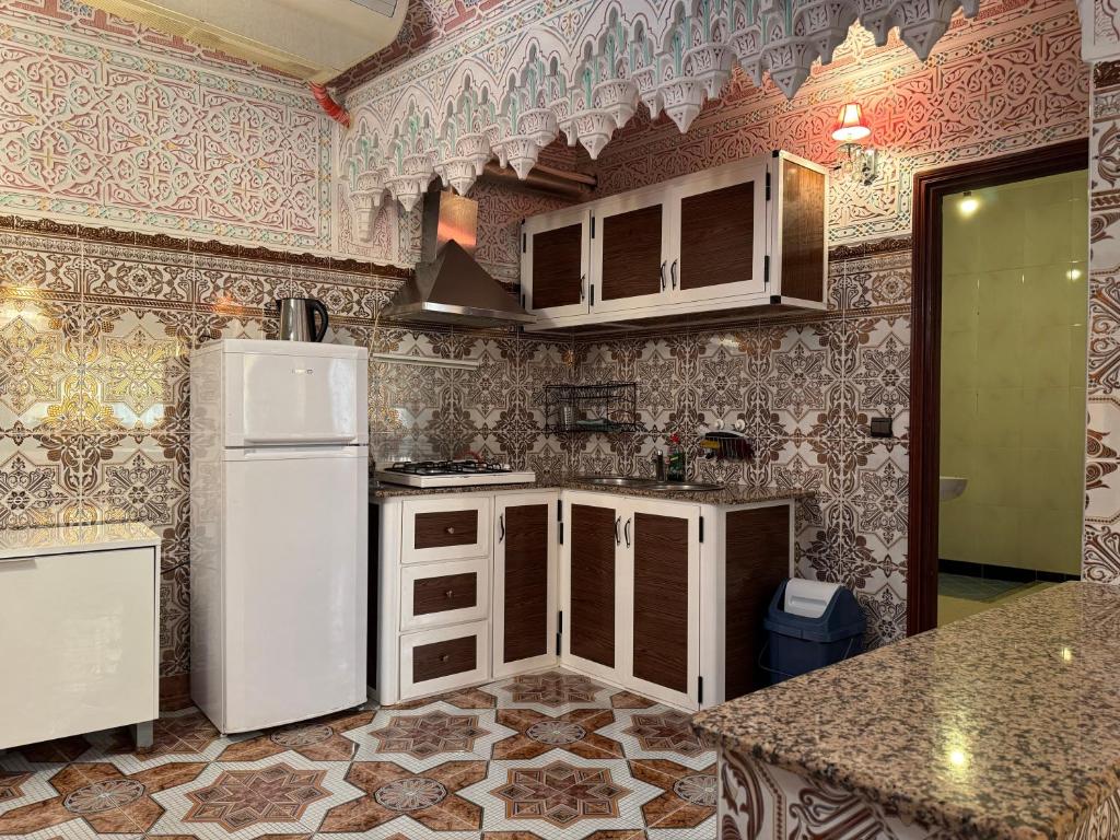 Kuchyň nebo kuchyňský kout v ubytování Appartements dior al hoceima