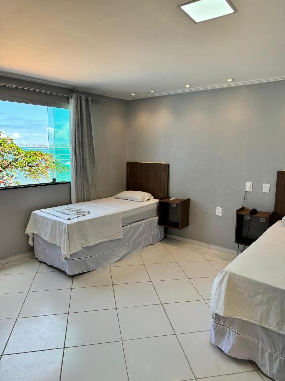 Postel nebo postele na pokoji v ubytování Hotel Luar de Itapua
