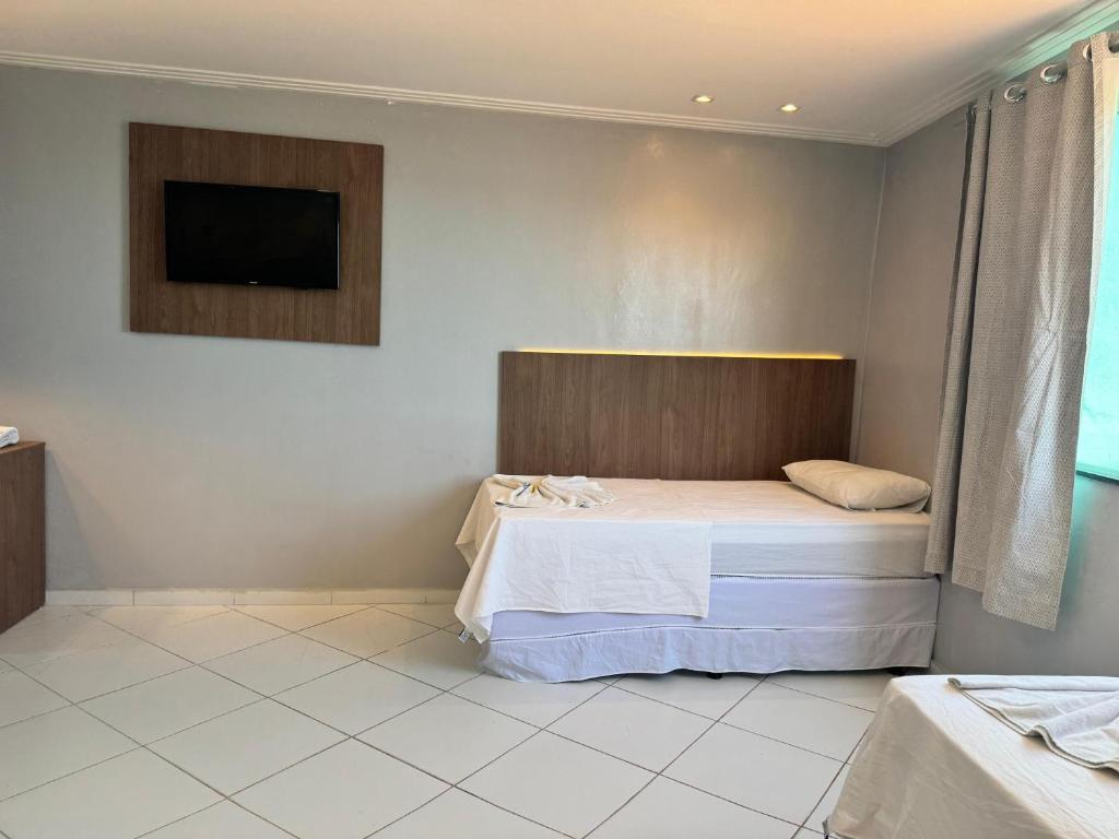 Postel nebo postele na pokoji v ubytování Hotel Luar de Itapua