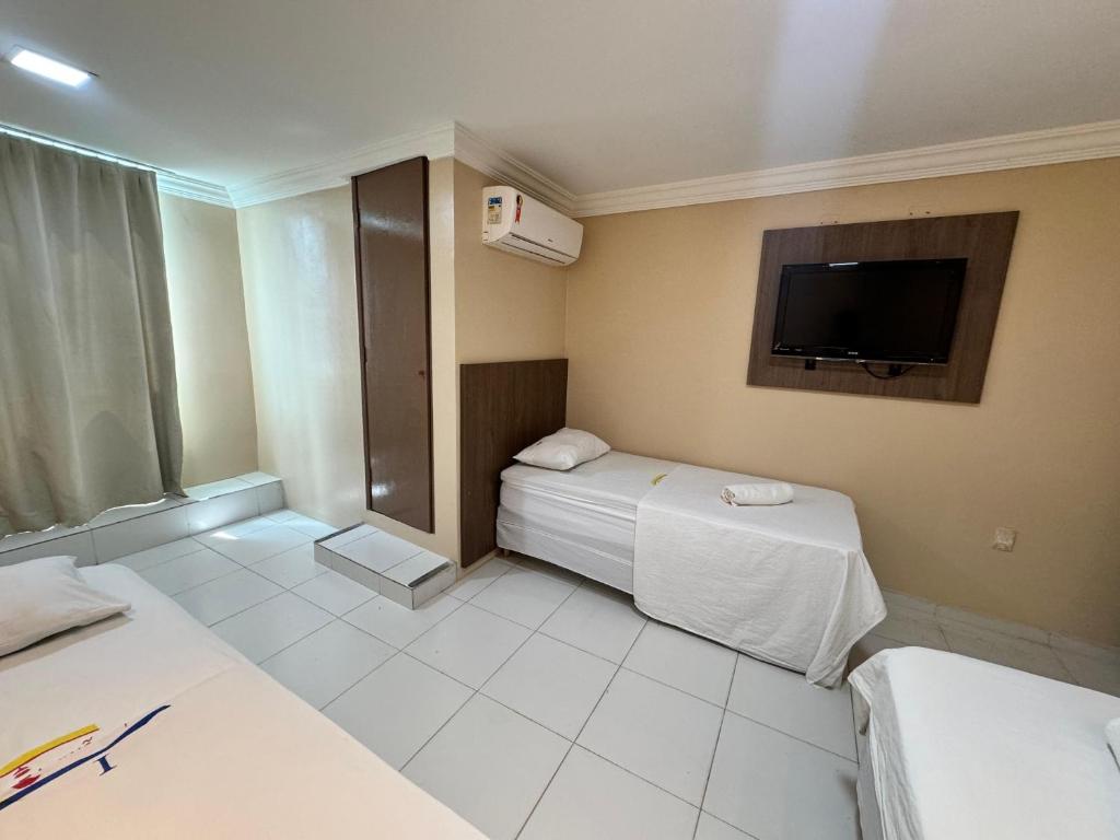 Postel nebo postele na pokoji v ubytování Hotel Luar de Itapua