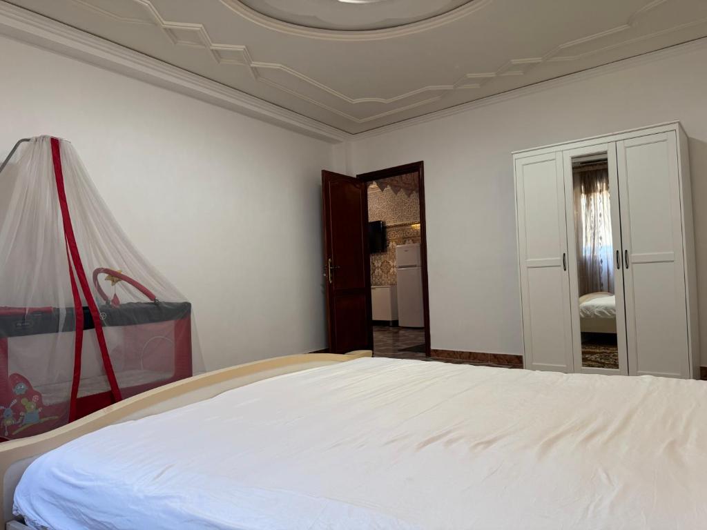 Postel nebo postele na pokoji v ubytování Appartements dior al hoceima