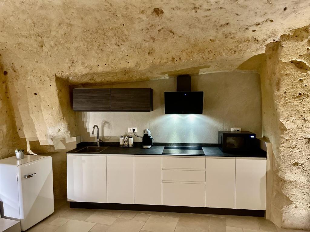 Η κουζίνα ή μικρή κουζίνα στο IL Nido nella Roccia