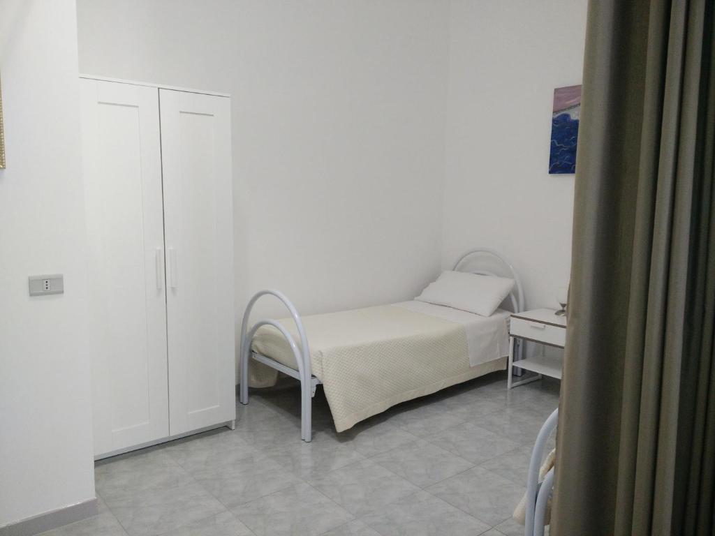 Łóżko lub łóżka w pokoju w obiekcie B&B Il Tramontano