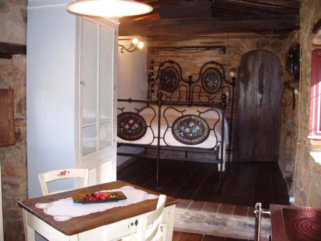 Postel nebo postele na pokoji v ubytování Podere Casina Rossa