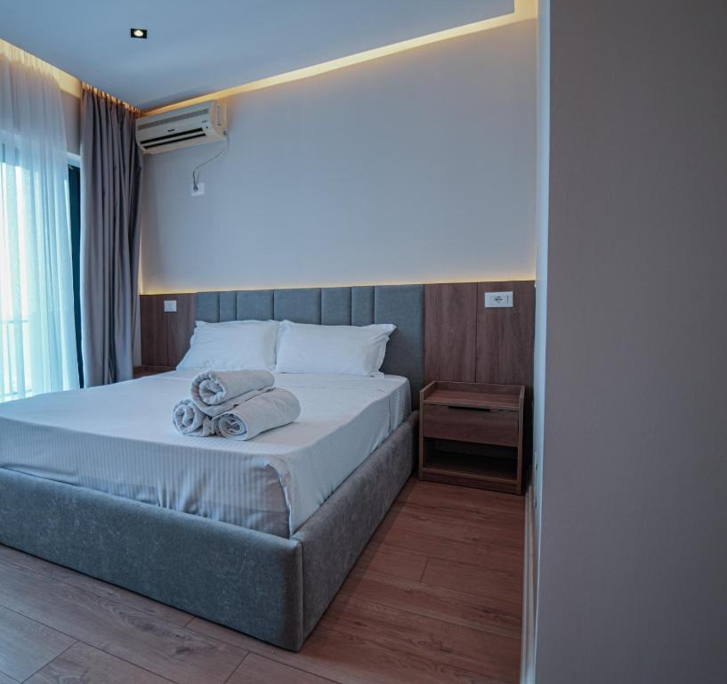 Postel nebo postele na pokoji v ubytování Hotel Sanremo Vlore