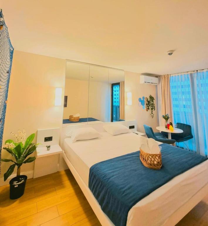 Postel nebo postele na pokoji v ubytování VIP ORBI CITY batumi