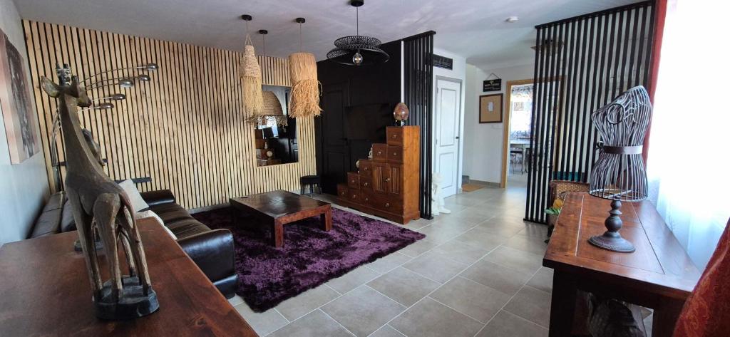a living room with a couch and a table at Locagites82 in Moissac