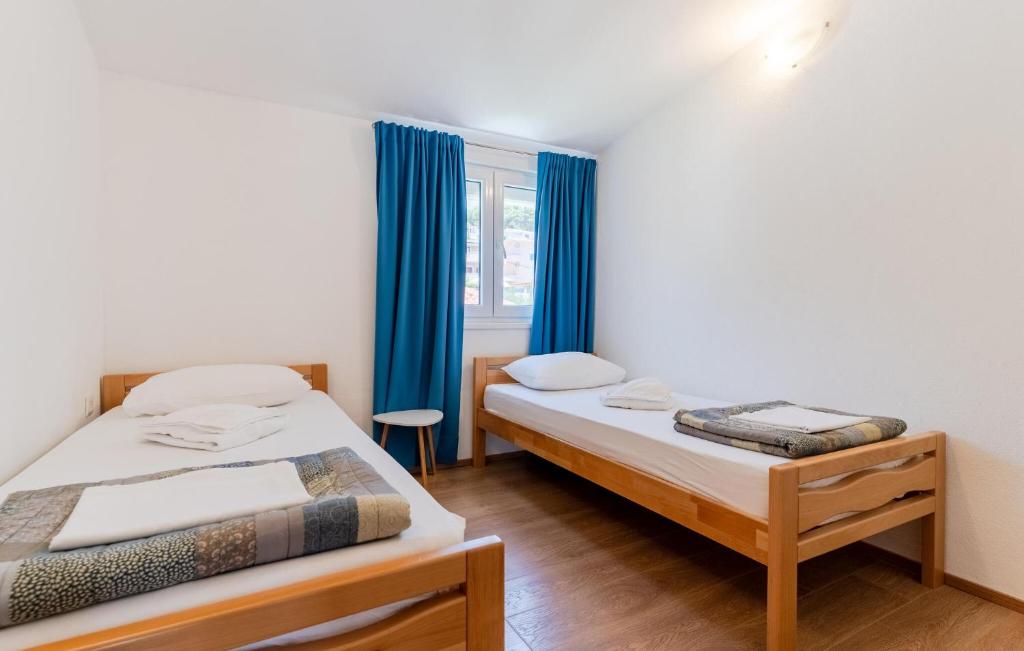 Posteľ alebo postele v izbe v ubytovaní 3 Bedroom Beautiful Apartment In Solin