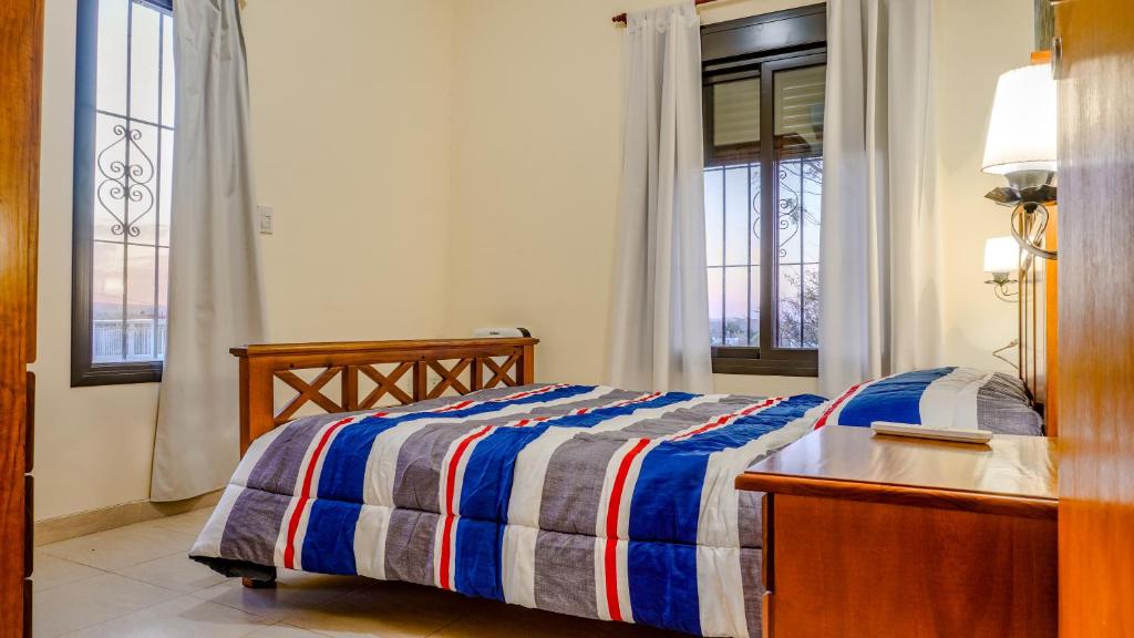 Una cama o camas en una habitación de Cabana Cala - Mirador de las sierras.