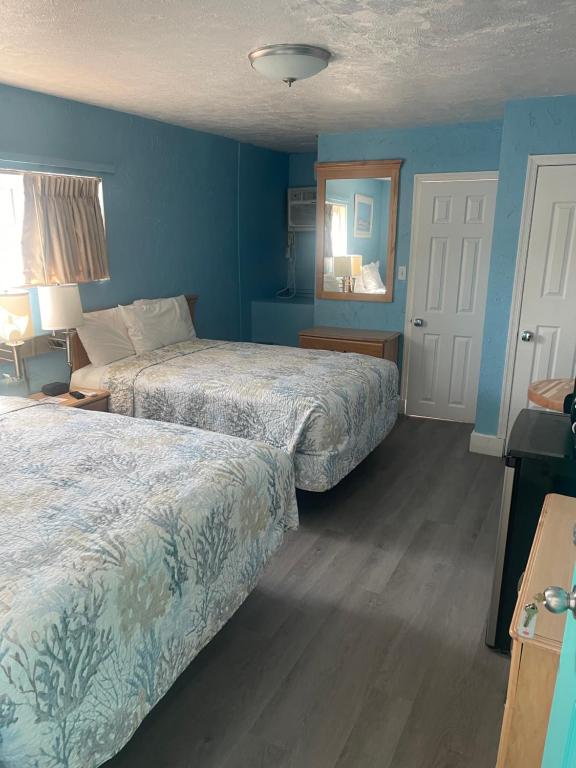 Postel nebo postele na pokoji v ubytování Surfcomber Motel