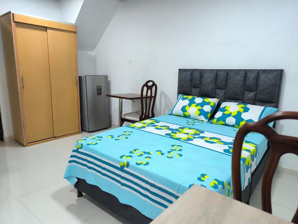 Postel nebo postele na pokoji v ubytování Cómodos y acogedores Apartaestudios - Manizales