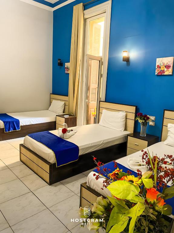 Postel nebo postele na pokoji v ubytování Hostgram Downtown Hotel & Suites