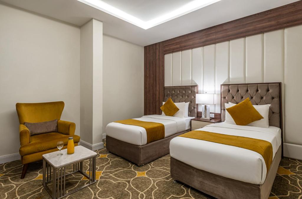 Postel nebo postele na pokoji v ubytování Garden Millennium Hotel