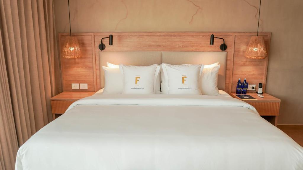 Giường trong phòng chung tại Faranda Collection Cúcuta