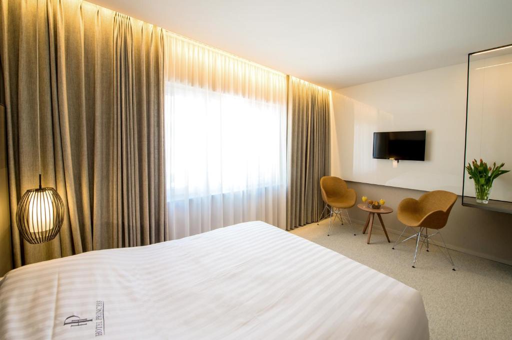 Postel nebo postele na pokoji v ubytování Hotel Princess