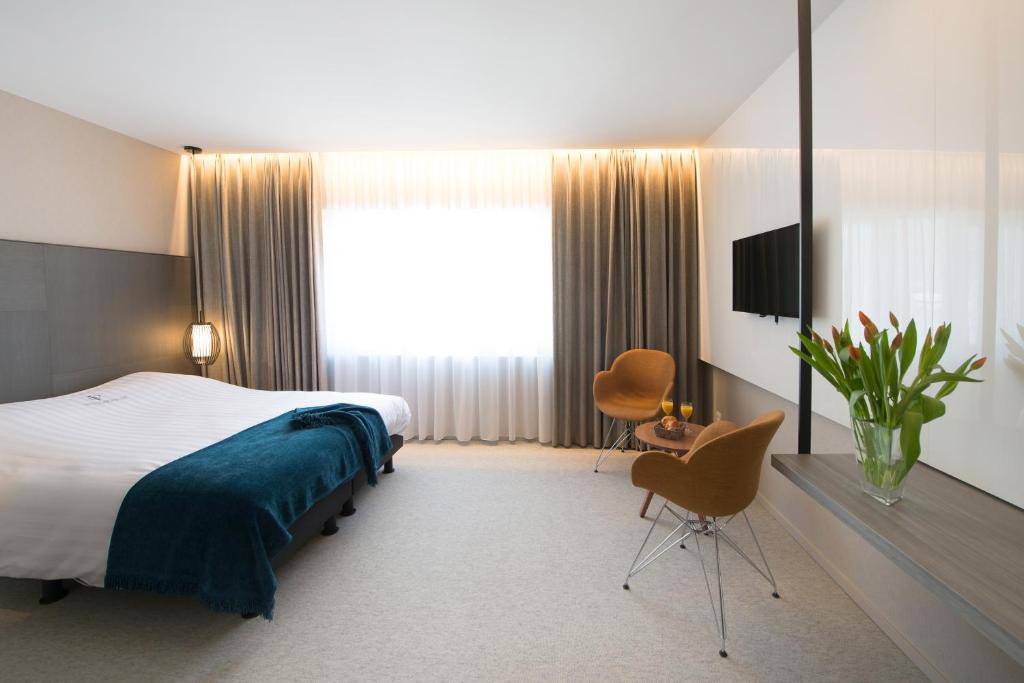Postel nebo postele na pokoji v ubytování Hotel Princess
