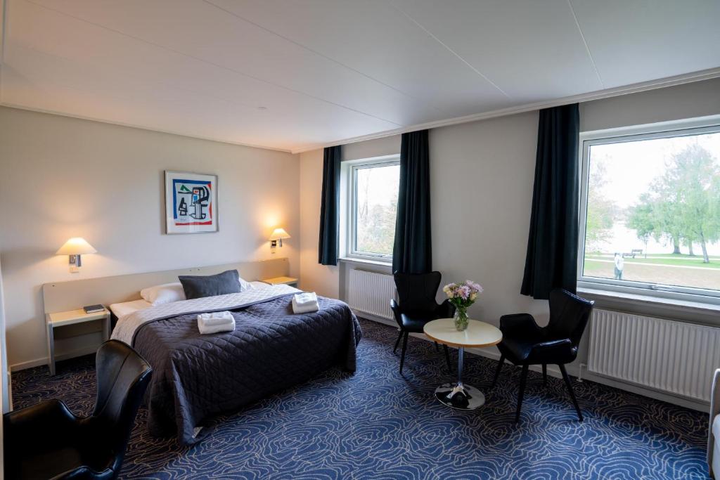 Postel nebo postele na pokoji v ubytování Hotel Norden