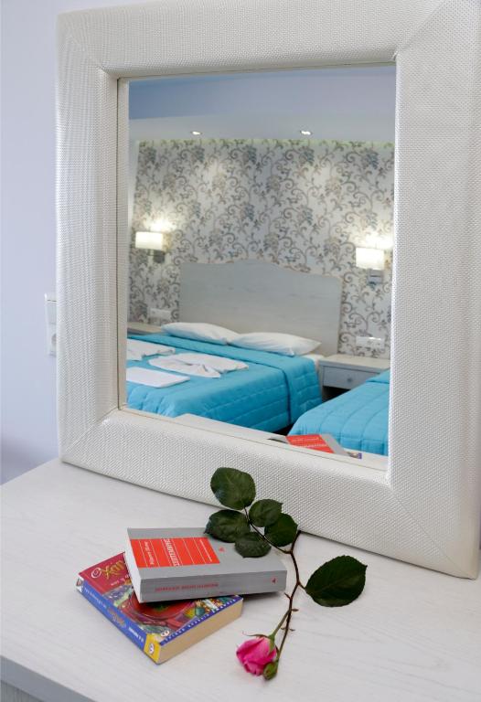 Postel nebo postele na pokoji v ubytování Hotel Akti