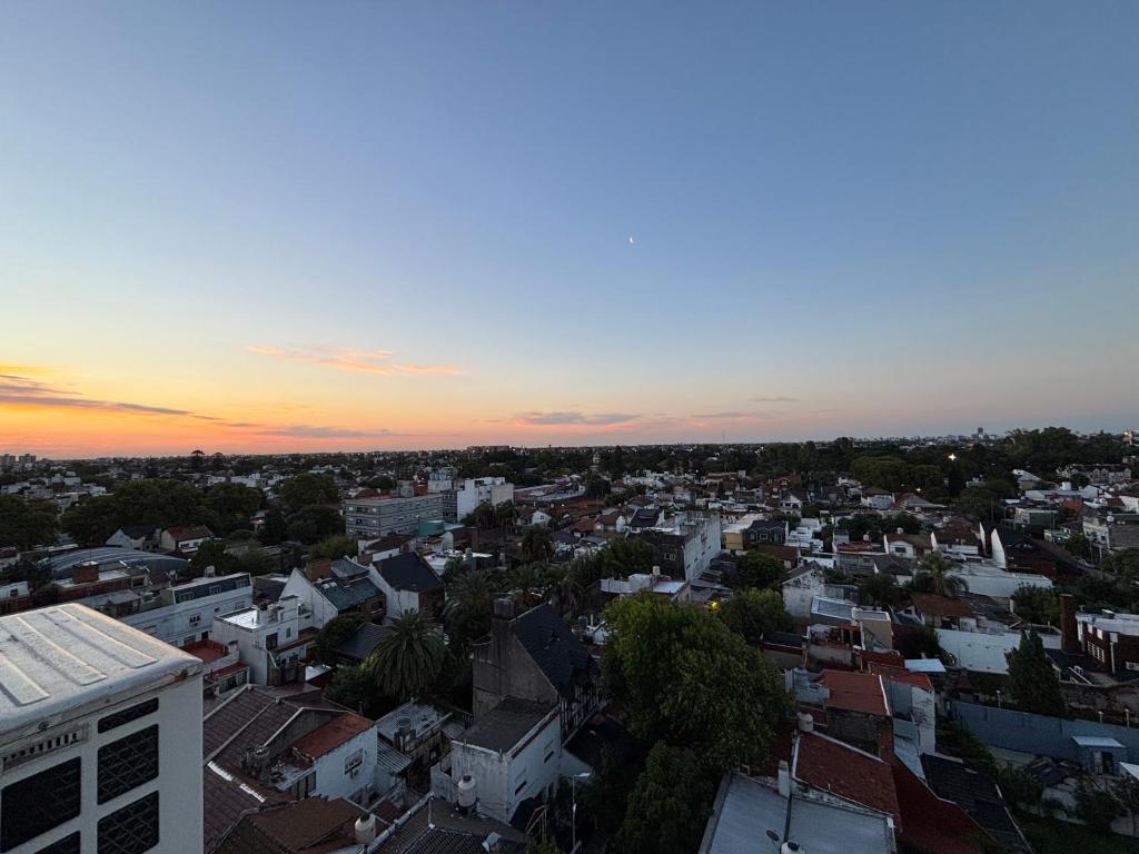 an aerial view of a city at sunset at MINISUITE GAONA - Studio - Estacion de Ramos Mejia in Ramos Mejía