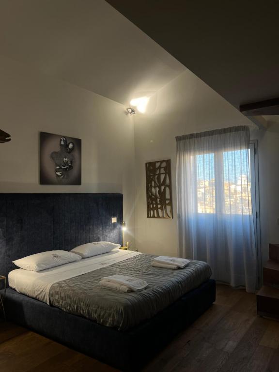 Postel nebo postele na pokoji v ubytování Atenea Palace Luxury Rooms - Atenea Collection