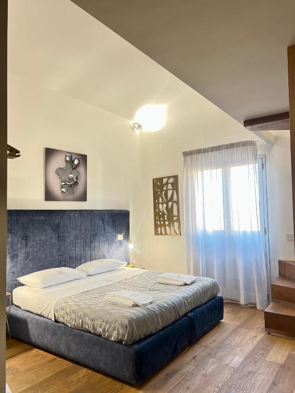 Postel nebo postele na pokoji v ubytování Atenea Palace Luxury Rooms - Atenea Collection