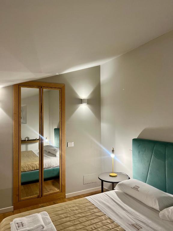 Postel nebo postele na pokoji v ubytování Atenea Palace Luxury Rooms - Atenea Collection