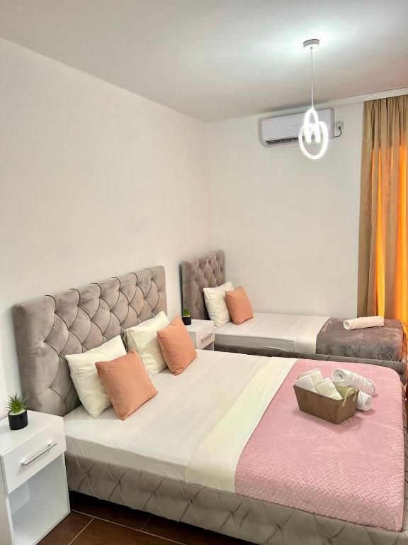 Postel nebo postele na pokoji v ubytování Apartments Katana