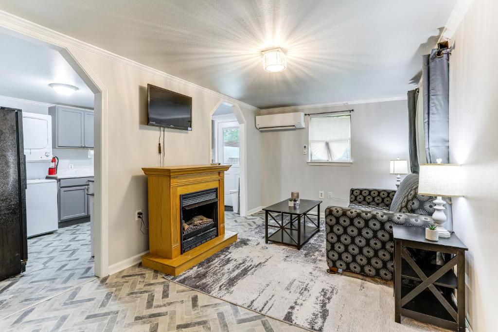 a living room with a fireplace and a couch at 14 Mi to Downtown Baton Rouge Plaquemine Retreat in Plaquemine