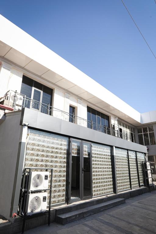 a facade of a building with an air conditioner at City hostel in Termiz