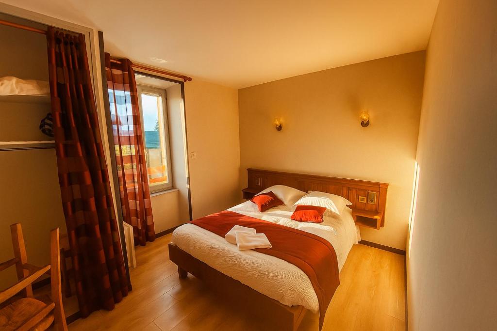 Postel nebo postele na pokoji v ubytování Le Relais de Lassouts