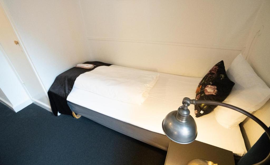 Postel nebo postele na pokoji v ubytování Hotel Vinhuset