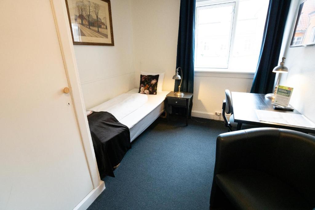 Postel nebo postele na pokoji v ubytování Hotel Vinhuset