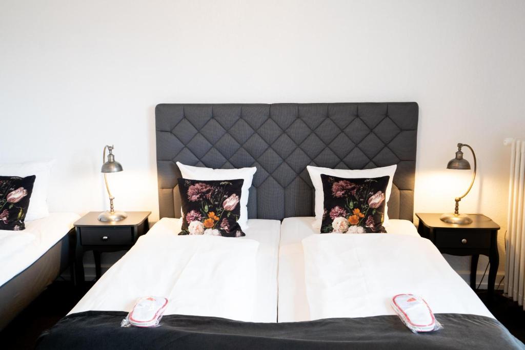 Postel nebo postele na pokoji v ubytování Hotel Vinhuset