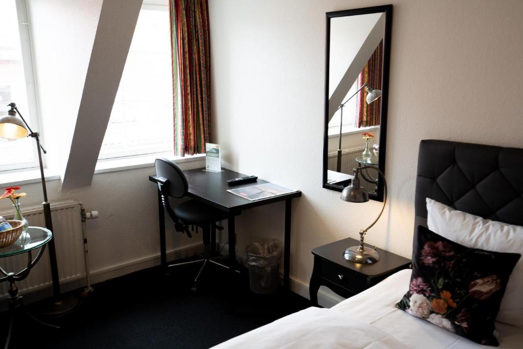 Postel nebo postele na pokoji v ubytování Hotel Vinhuset
