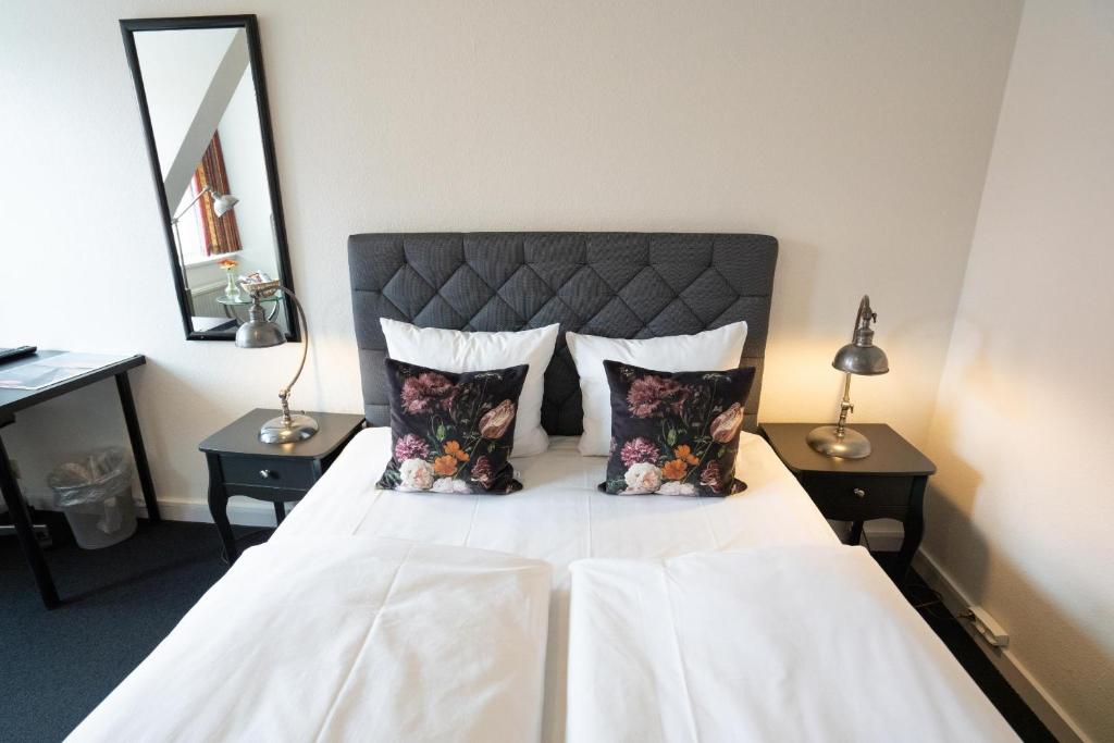 Postel nebo postele na pokoji v ubytování Hotel Vinhuset