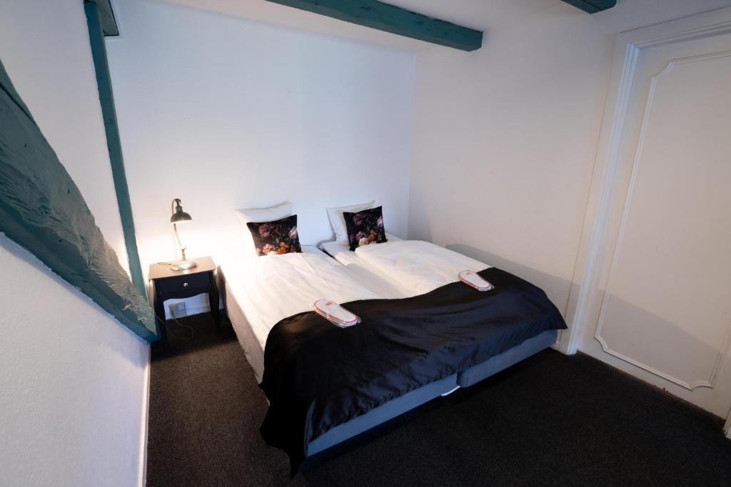 Postel nebo postele na pokoji v ubytování Hotel Vinhuset