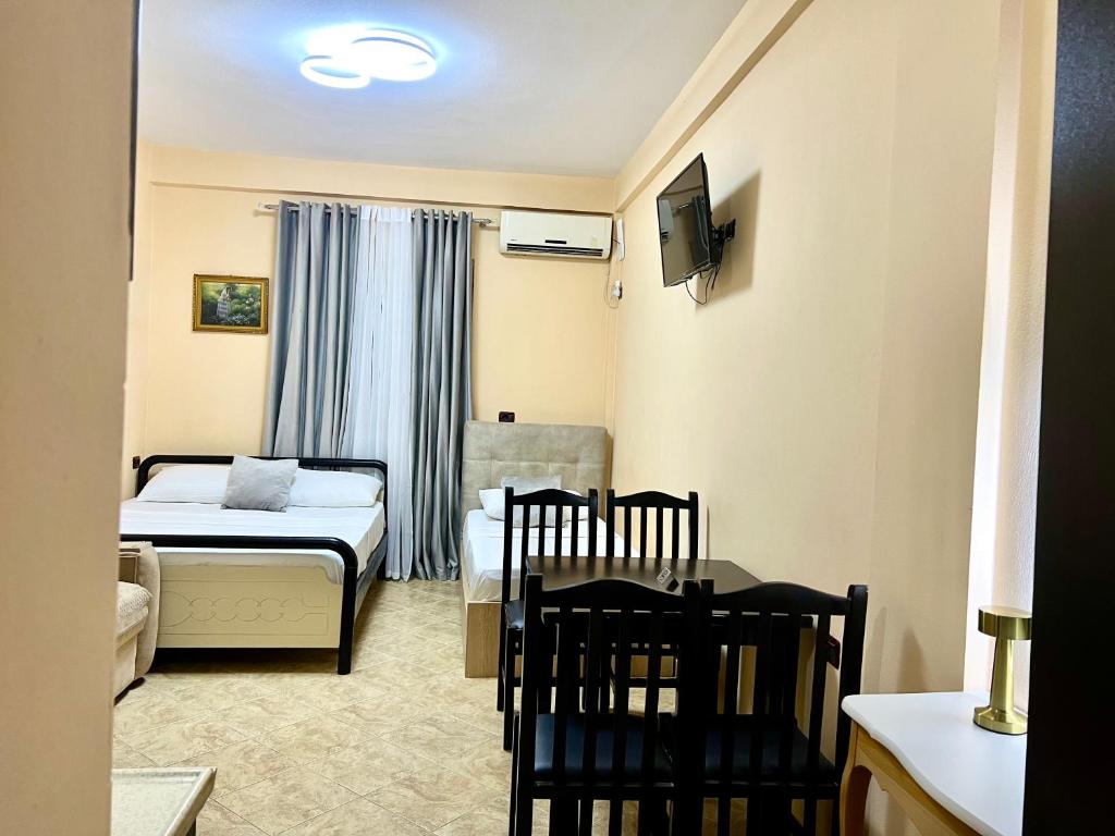 Ένα ή περισσότερα κρεβάτια σε δωμάτιο στο Hotel Asteri