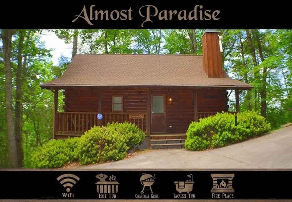 a small wooden cabin in the middle of the woods at Location Log Cabin Hot Tub Fireplace Pool Fishing in Pigeon Forge