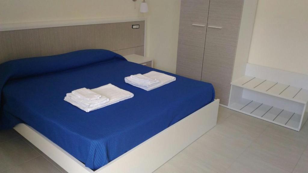 Postel nebo postele na pokoji v ubytování Il Girasole Formia Guesthouse rooms