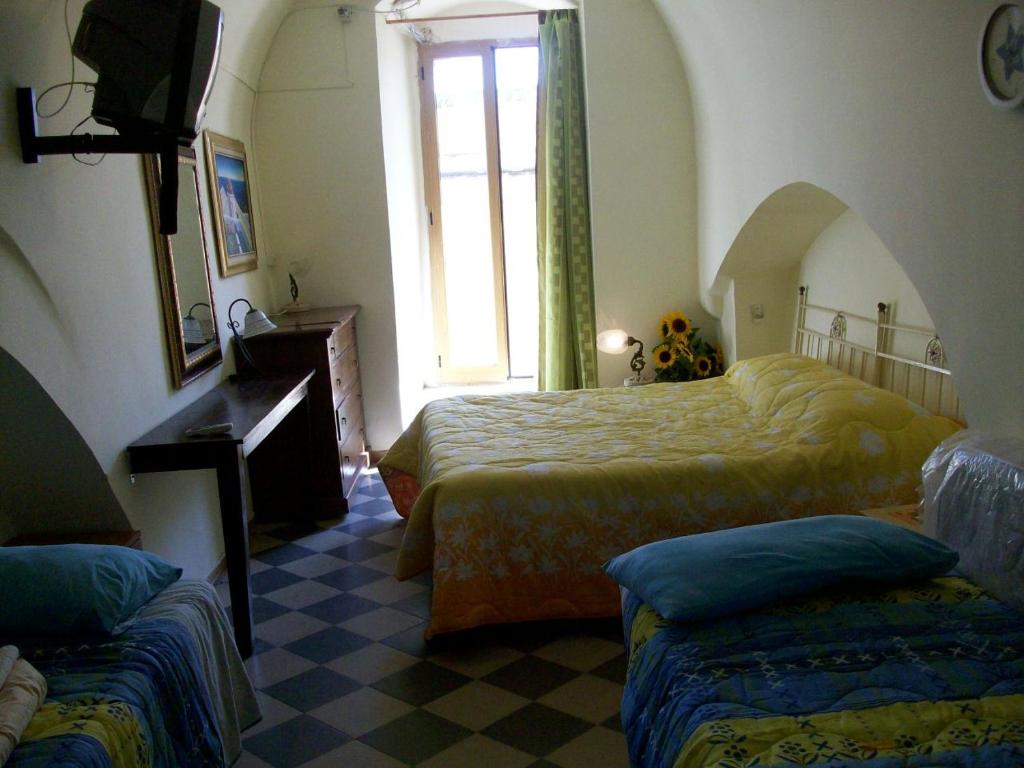 Giường trong phòng chung tại casa vacanze via san pardo