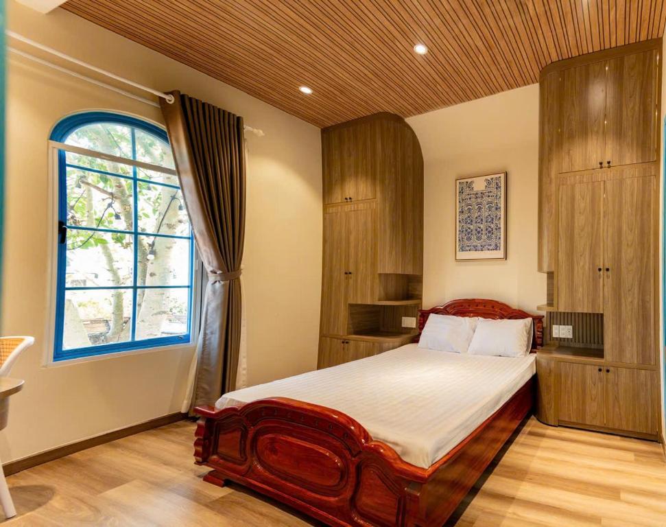 Ένα ή περισσότερα κρεβάτια σε δωμάτιο στο ALO Homestay PHAN THIẾT
