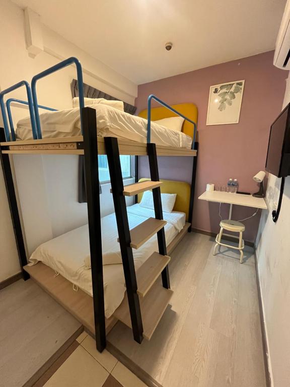 Postel nebo postele na pokoji v ubytování Havona hotel - Taman Tropika Kulai