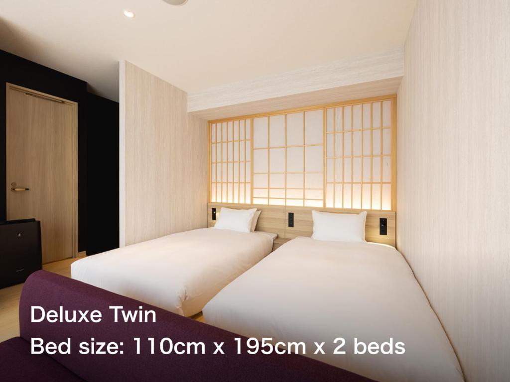 Postel nebo postele na pokoji v ubytování La'gent Hotel Kyoto Nijo