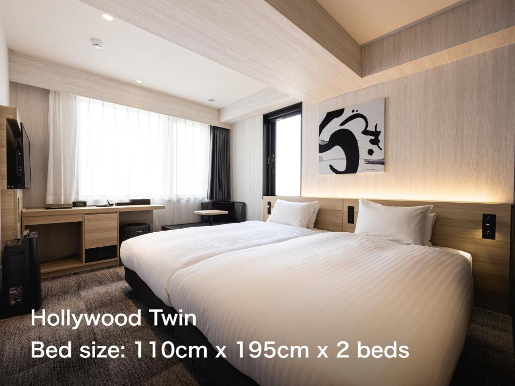 Postel nebo postele na pokoji v ubytování La'gent Hotel Kyoto Nijo