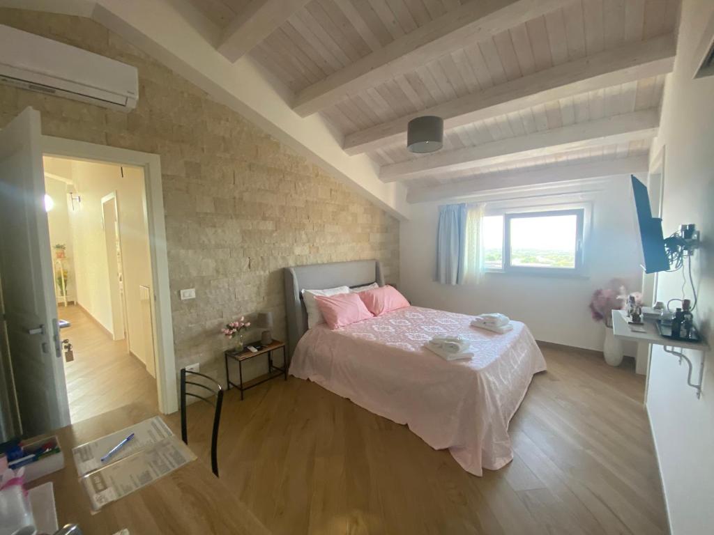 Postel nebo postele na pokoji v ubytování Villa Giusy