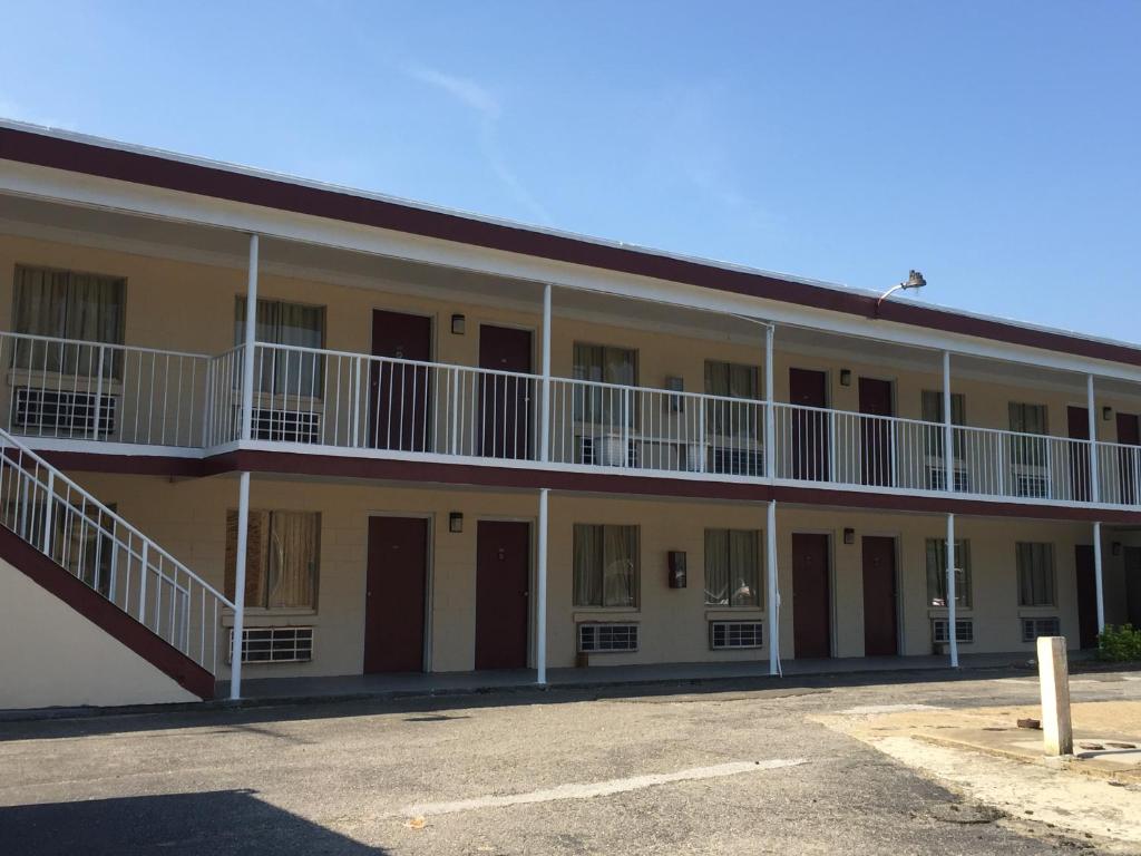 a building with balconies on the side of it at Fort Eustis Inn in Newport News