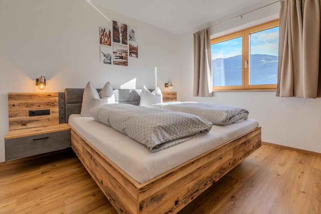 Postel nebo postele na pokoji v ubytování Appart Zellblick