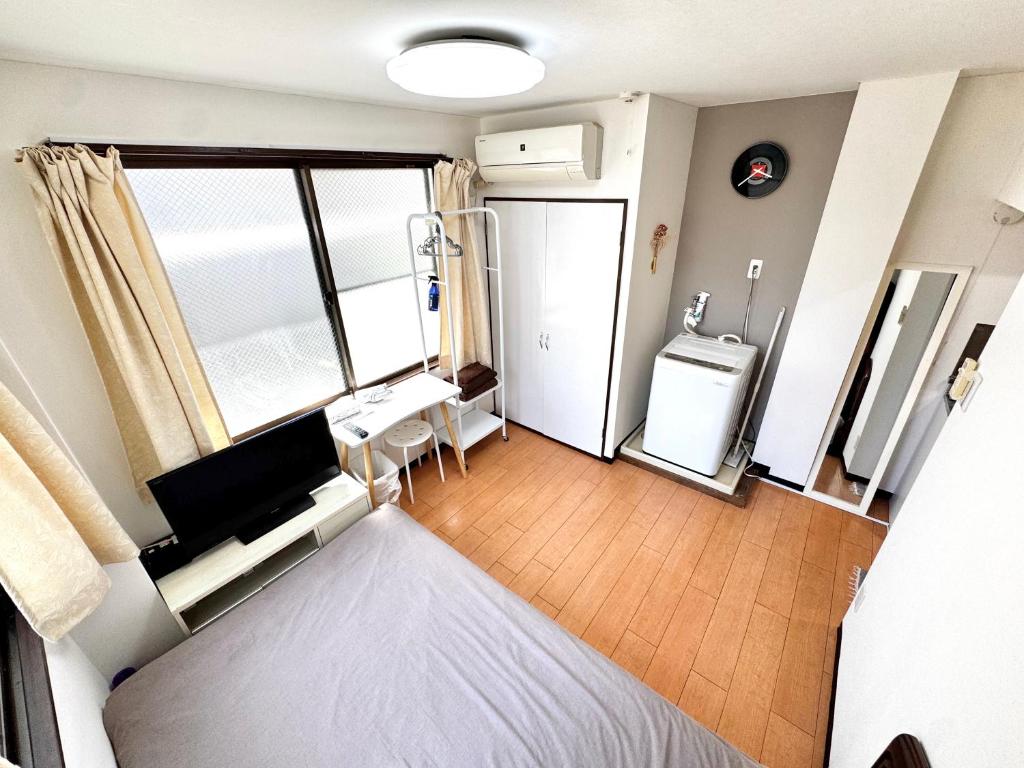 Postel nebo postele na pokoji v ubytování Kawaguchi house
