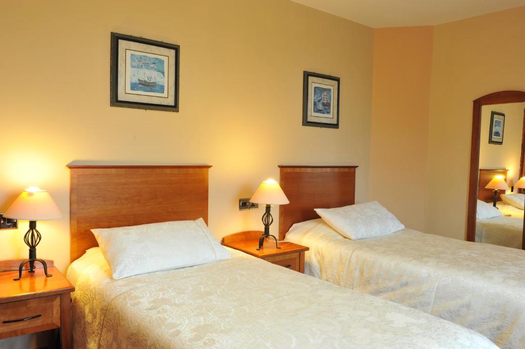 Postel nebo postele na pokoji v ubytování Fitzgeralds Hotel